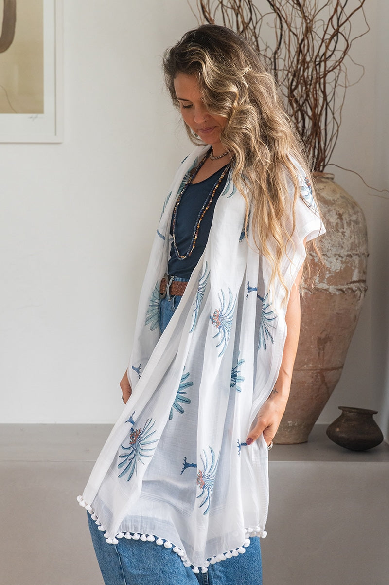 Ladies scarf, hand-loomed and hand block printed with pom poms. 70% Silk & 30% Cotton. Sundara scarf in Aqua Blue Palm print