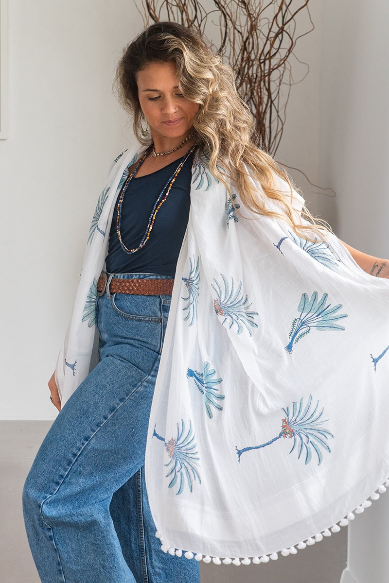Ladies scarf, hand-loomed and hand block printed with pom poms. 70% Silk & 30% Cotton. Sundara scarf in Aqua Blue Palm print