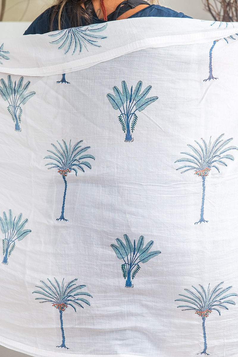Ladies scarf, hand-loomed and hand block printed with pom poms. 70% Silk & 30% Cotton. Sundara scarf in Aqua Blue Palm print