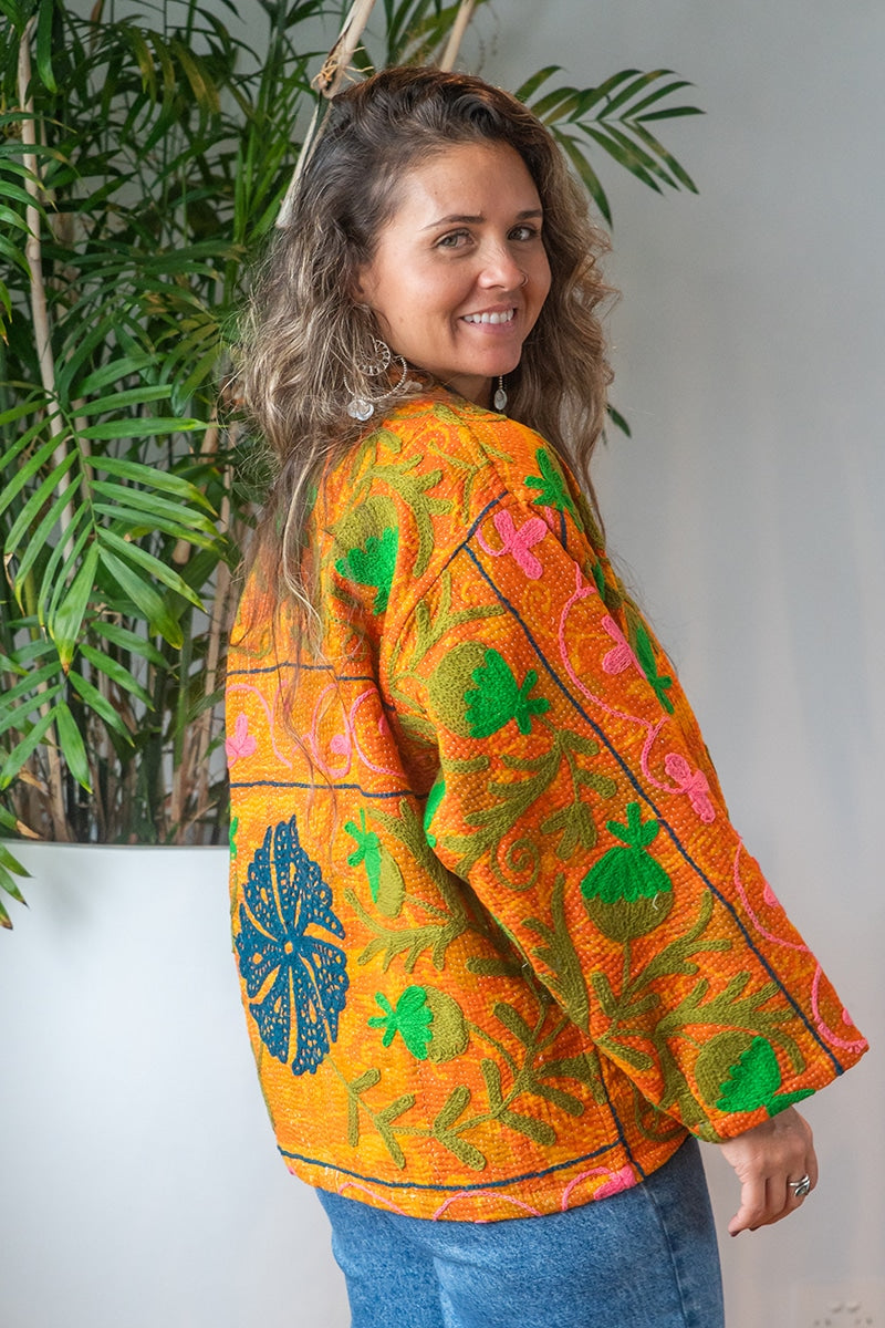 Womens Elysian Kantha Jacket, with traditional Suzani embroidery, handmade from recycled Vintage Kantha’s. Saffron orange
