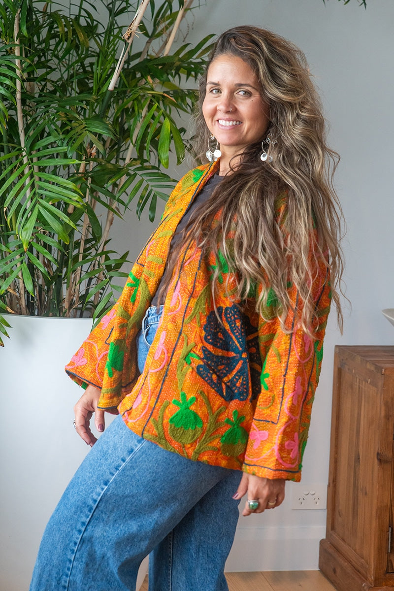 Womens Elysian Kantha Jacket, with traditional Suzani embroidery, handmade from recycled Vintage Kantha’s. Saffron orange
