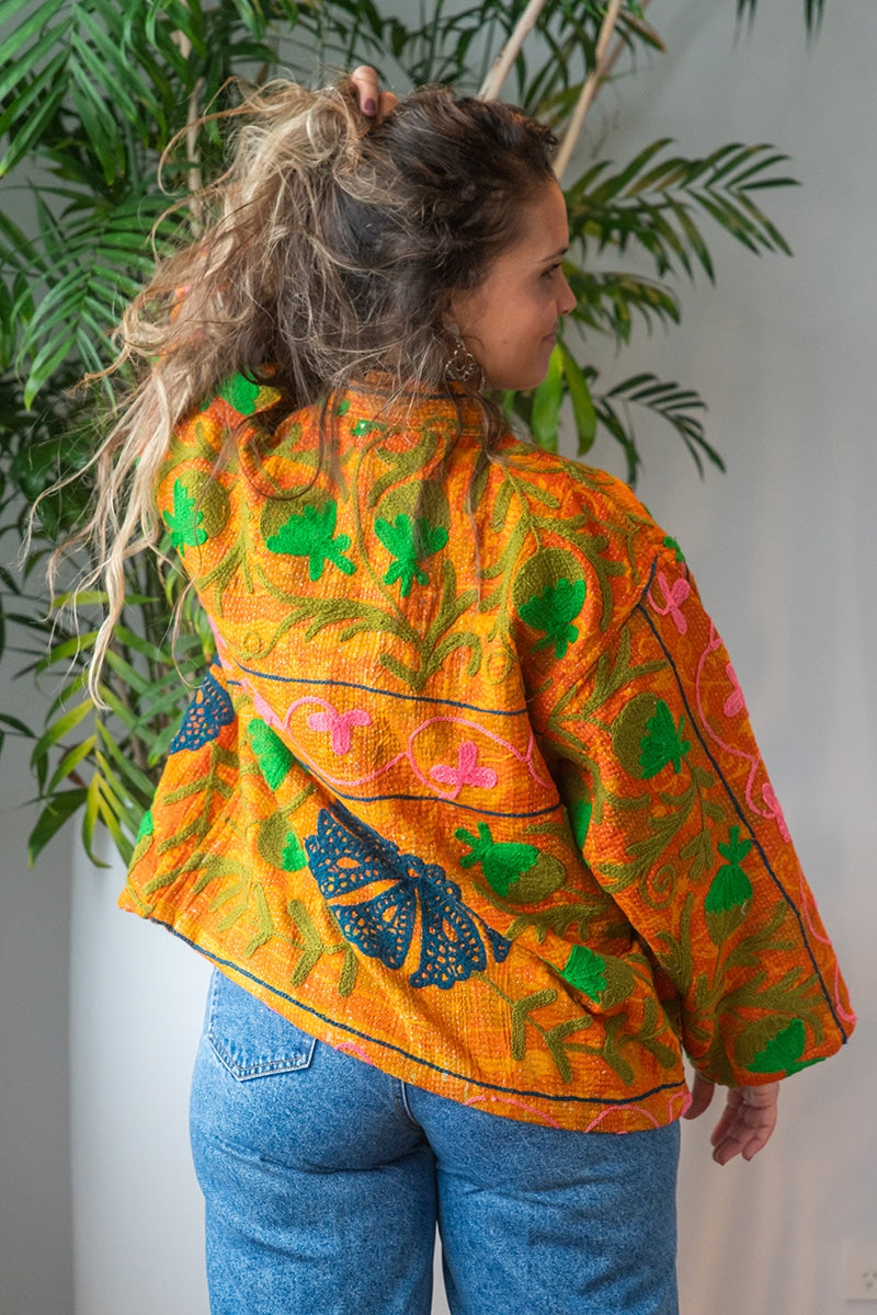 Womens Elysian Kantha Jacket, with traditional Suzani embroidery, handmade from recycled Vintage Kantha’s. Saffron orange