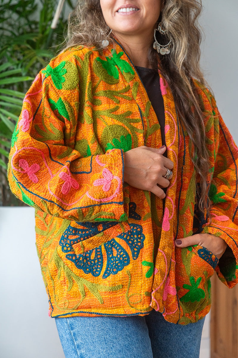 Womens Elysian Kantha Jacket, with traditional Suzani embroidery, handmade from recycled Vintage Kantha’s. Saffron orange