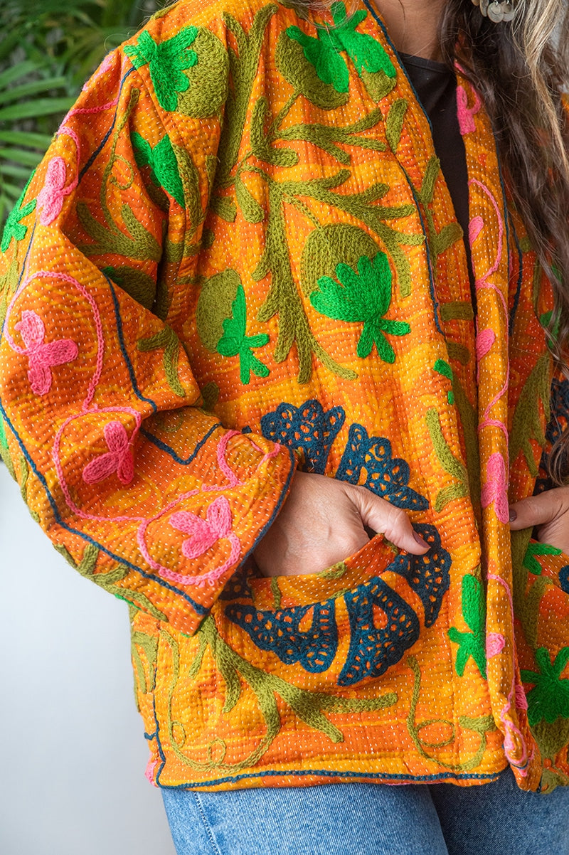 Womens Elysian Kantha Jacket, with traditional Suzani embroidery, handmade from recycled Vintage Kantha’s. Saffron orange